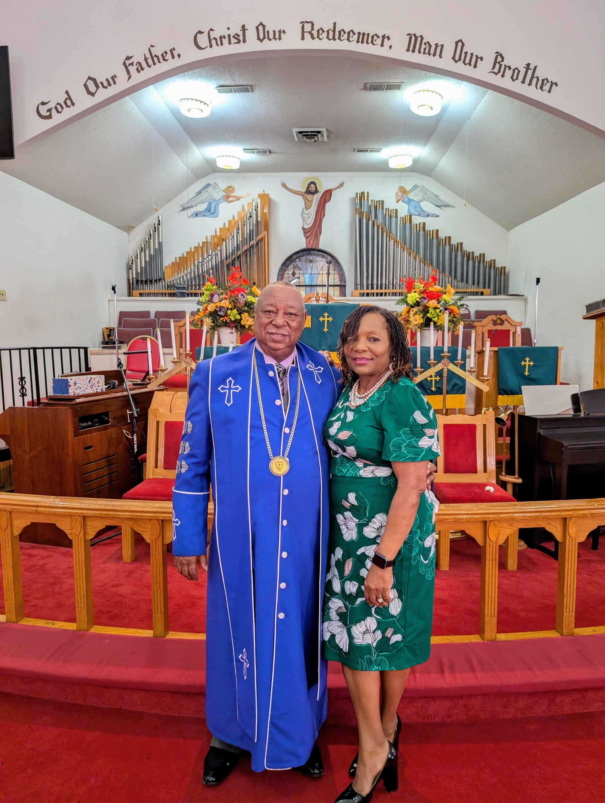Rev. and Mrs. McLamore at altar